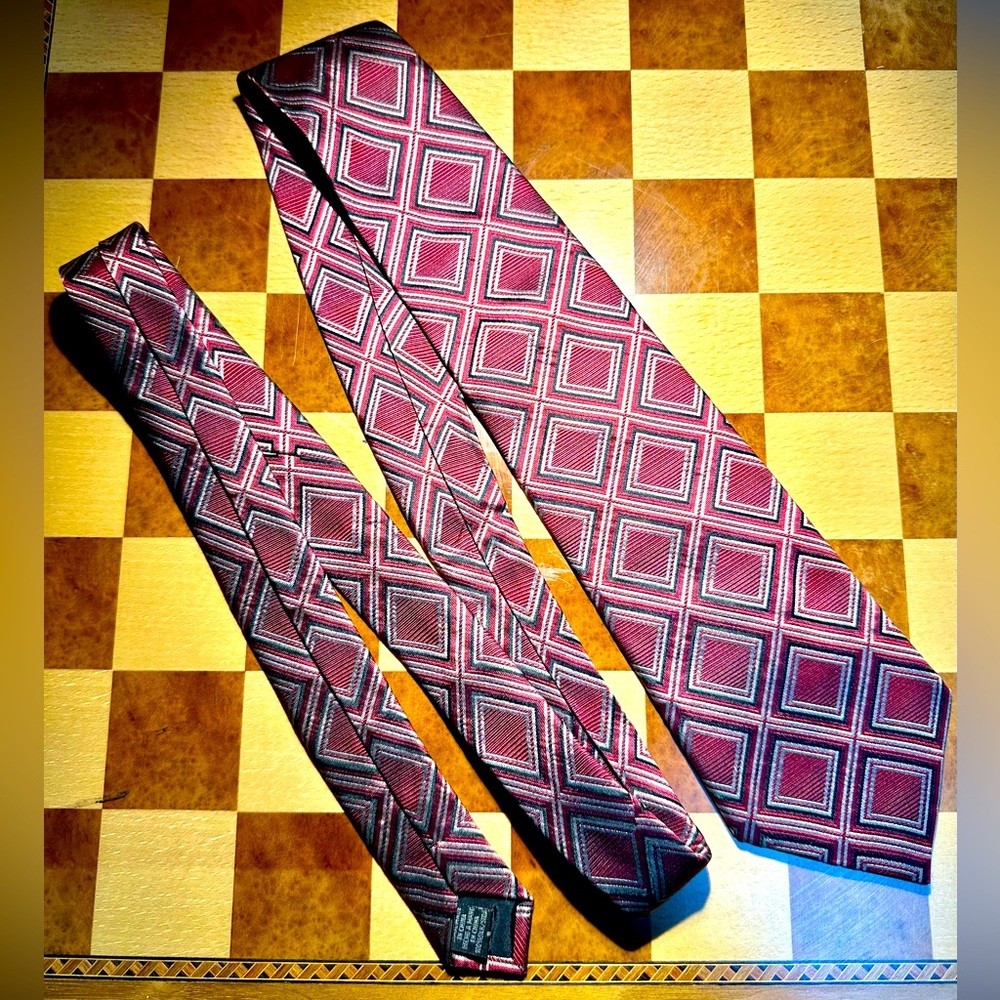 Geoffrey Beene tie with bold geometric pattern featuring red blackandwhite hues